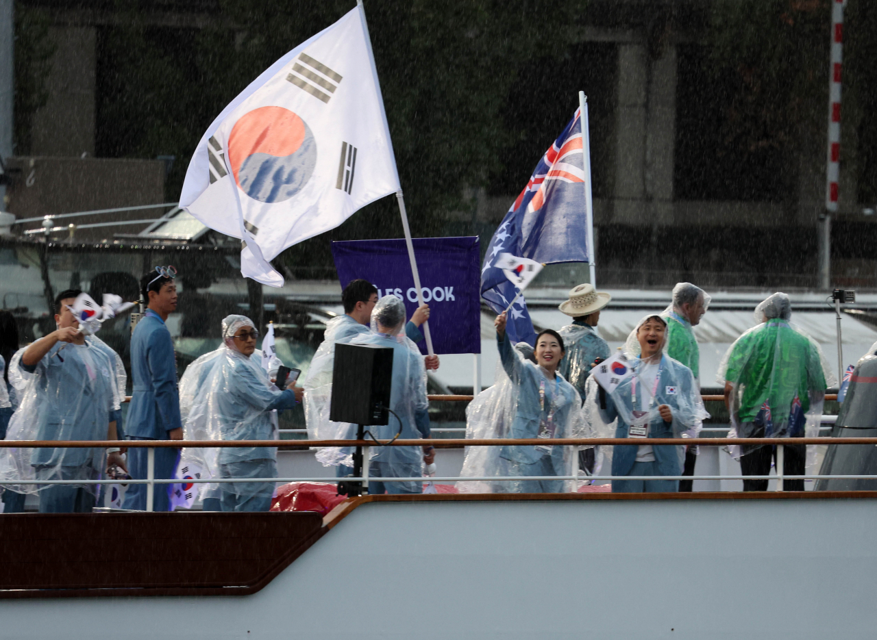 The South Korean delegation to the Paris Olympics rides a boat on the Seine River during the opening ceremony on Friday. (Yonhap)